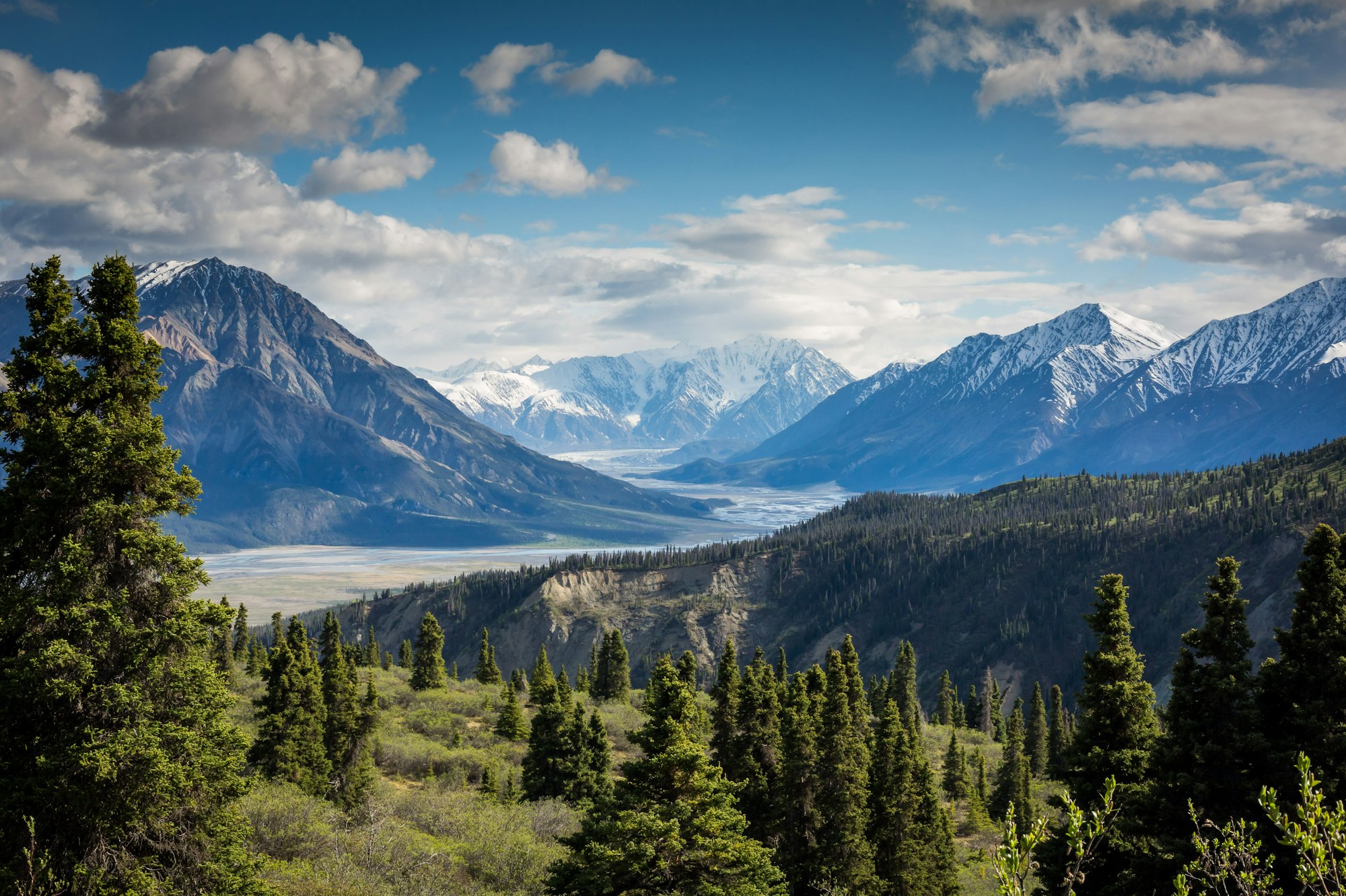A still northern lake below snow-streaked mountains